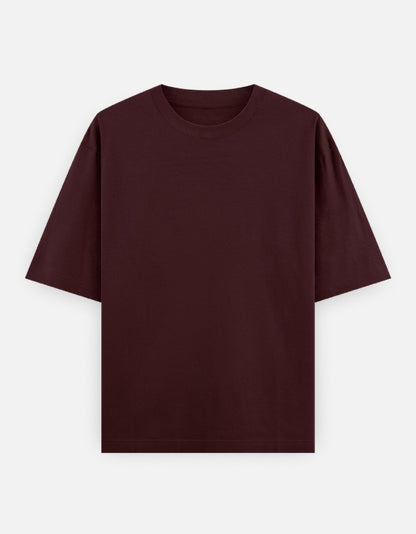 Maroon oversized tshirt with crow holding eyeball graphic and bold Kaga Re Kaga text – The Smoky Skull front view 