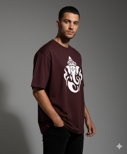 Maroon t-shirt with white Ganesha print worn by a male model in a photoshoot. The Smoky Skull
